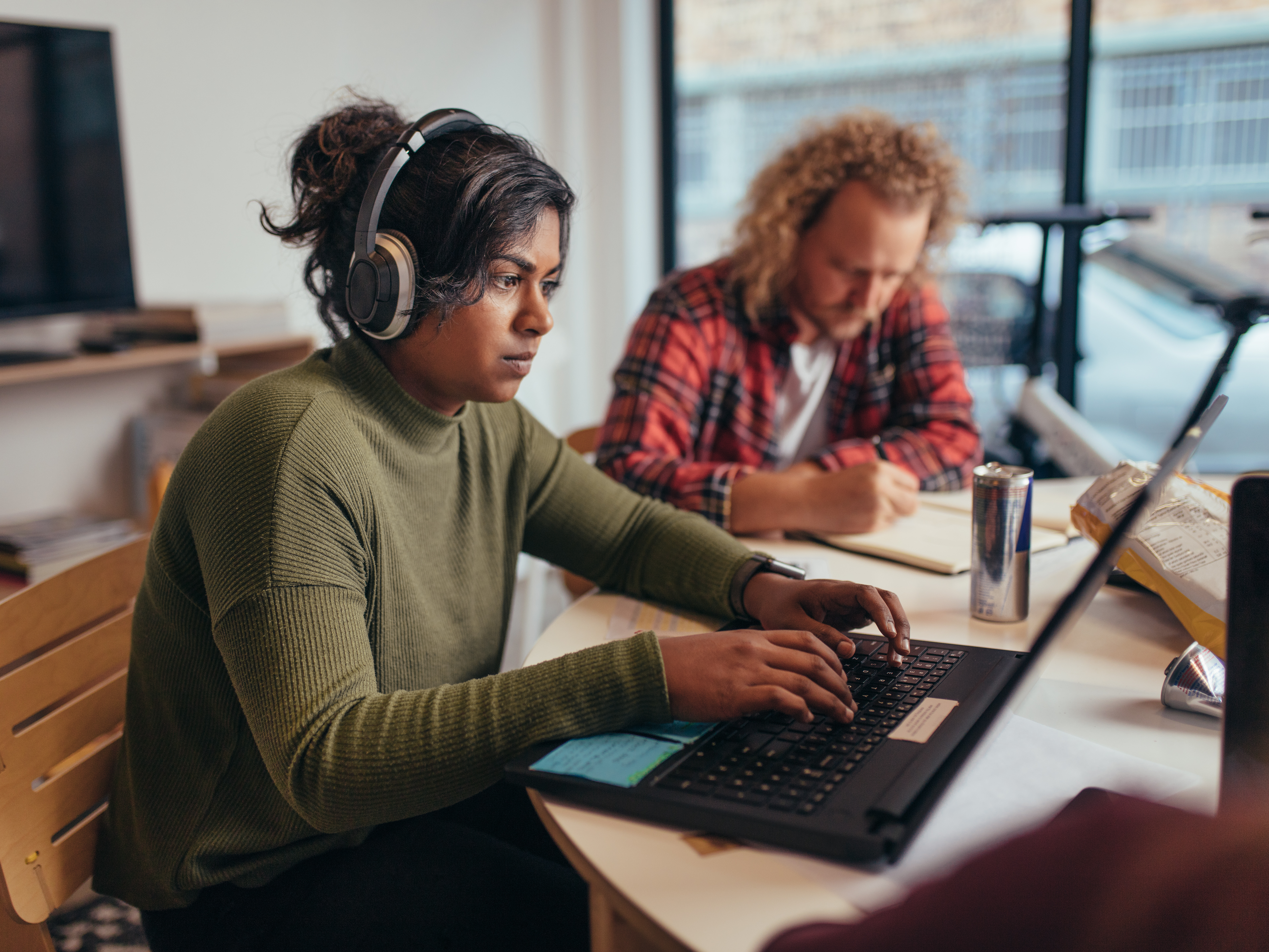 Team member working productively with headphones